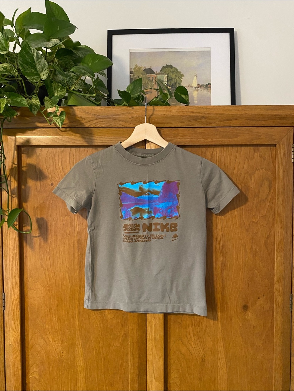 Nike Kids Olive Green Tee with Holographic Blue-Purple Graphic